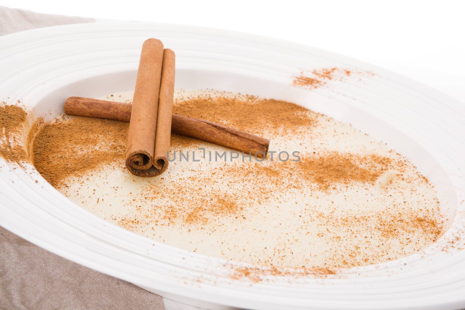 Delicious porridge breakfast with cinnamon and cocoa powder. Traditional breakfast eating. 