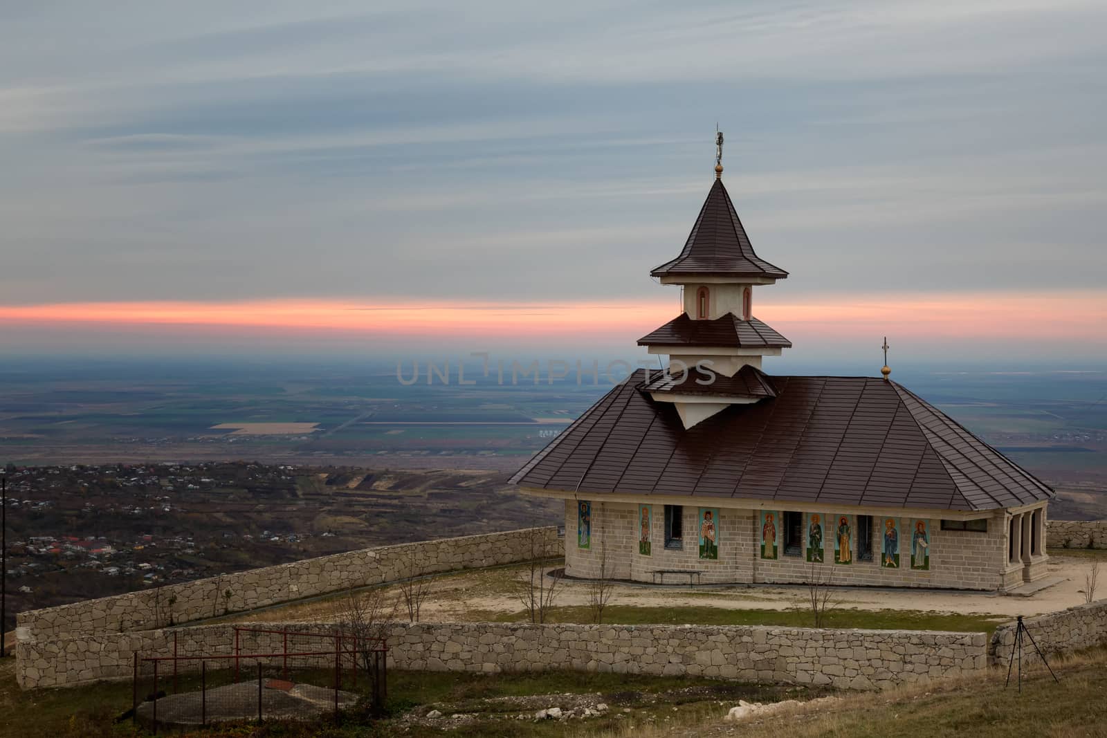 One stone church in a beautiful morning sunrise at Buzau, Romania.
