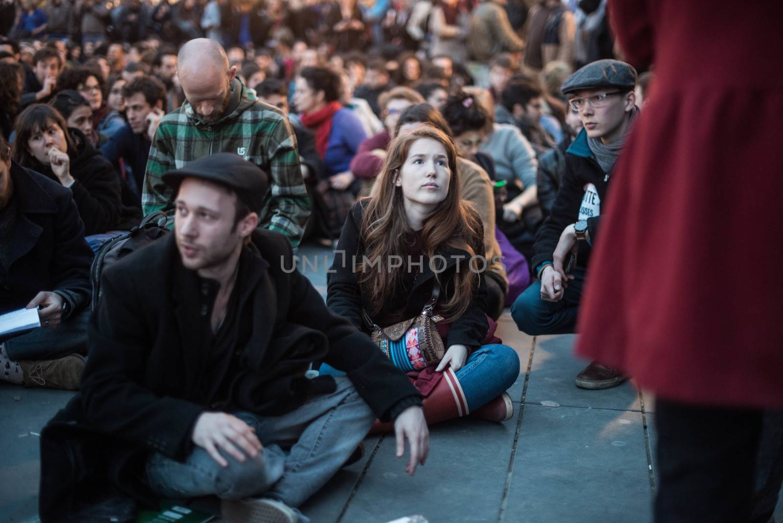 FRANCE, Paris: Hundreds of militants of the Nuit Debout or Standing night movement hold a general assembly to vote about the developments of the movement at the Place de la Republique in Paris on April 3, 2016. It has been four days that hundred of people have occupied the square to show, at first, their opposition to the labour reforms in the wake of the nationwide demonstration which took place on March 31, 2016.