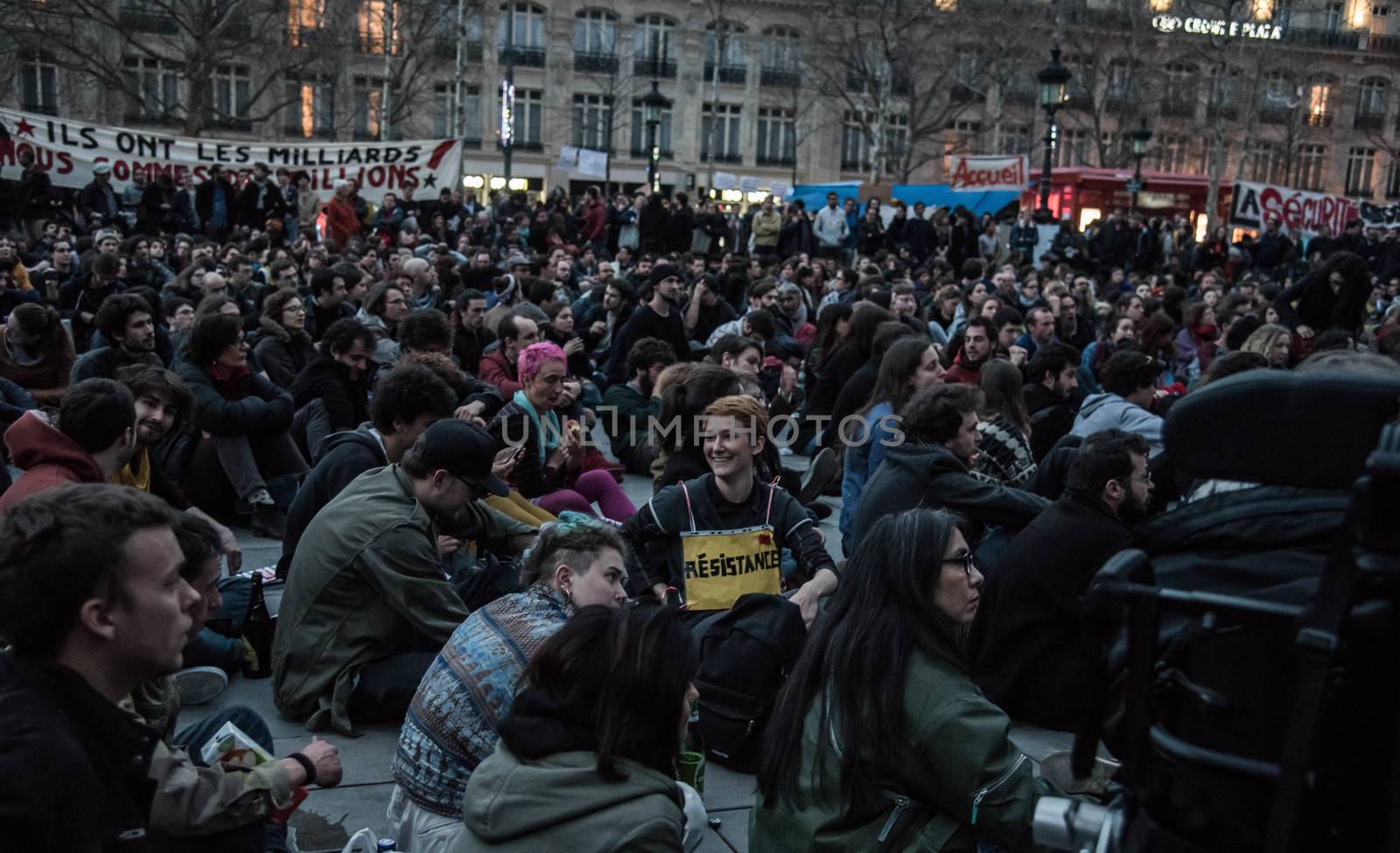 FRANCE, Paris: Hundreds of militants of the Nuit Debout or Standing night movement hold a general assembly to vote about the developments of the movement at the Place de la Republique in Paris on April 3, 2016. It has been four days that hundred of people have occupied the square to show, at first, their opposition to the labour reforms in the wake of the nationwide demonstration which took place on March 31, 2016.