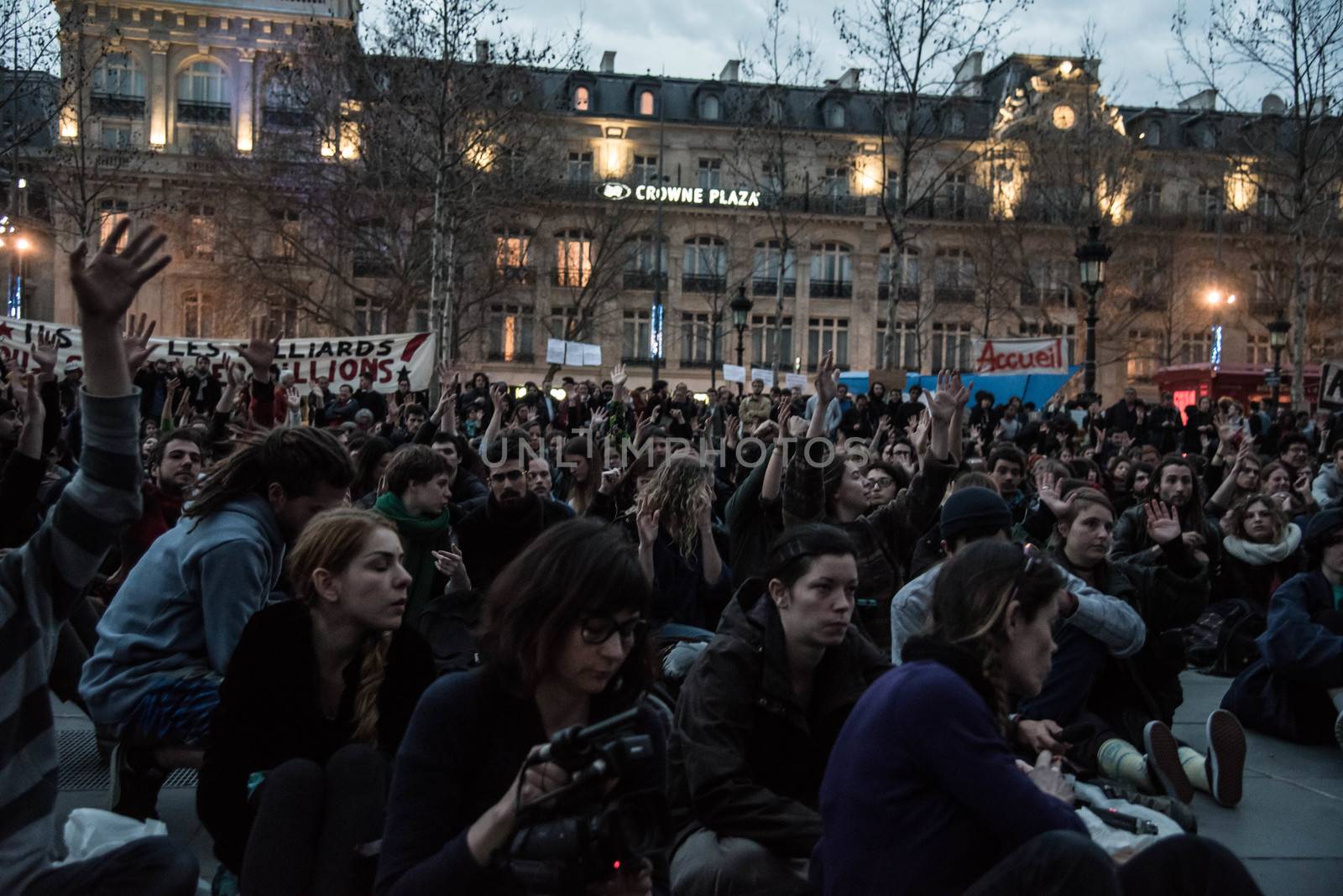 FRANCE, Paris: Hundreds of militants of the Nuit Debout or Standing night movement hold a general assembly to vote about the developments of the movement at the Place de la Republique in Paris on April 3, 2016. It has been four days that hundred of people have occupied the square to show, at first, their opposition to the labour reforms in the wake of the nationwide demonstration which took place on March 31, 2016.