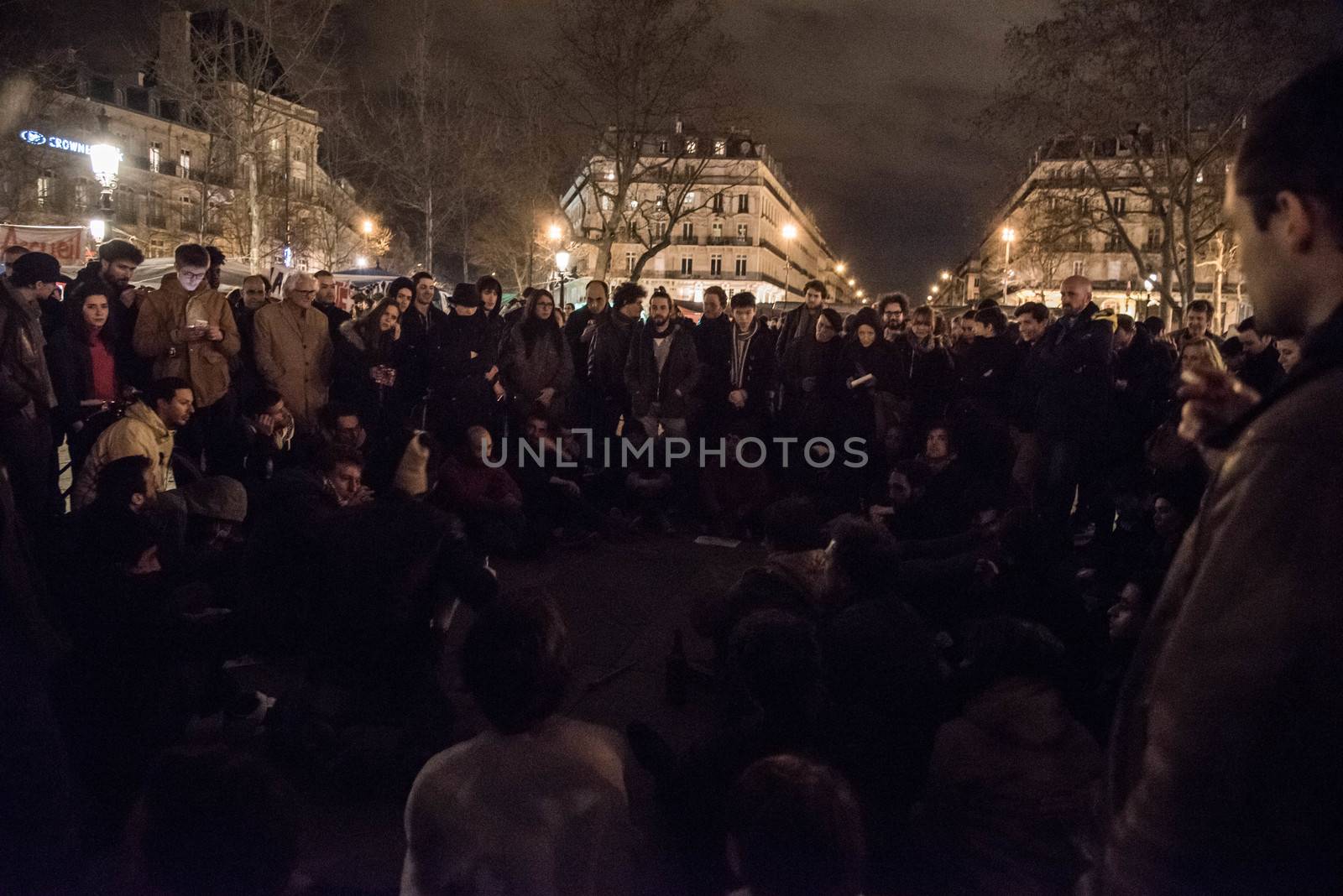 FRANCE, Paris: Hundreds of militants of the Nuit Debout or Standing night movement hold a general assembly to vote about the developments of the movement at the Place de la Republique in Paris on April 3, 2016. It has been four days that hundred of people have occupied the square to show, at first, their opposition to the labour reforms in the wake of the nationwide demonstration which took place on March 31, 2016.