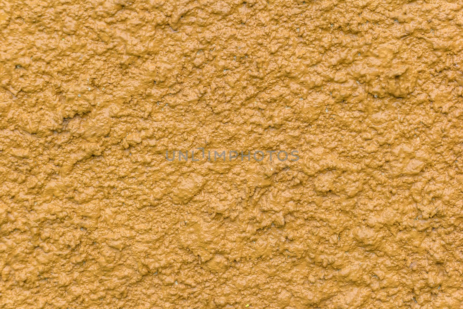 Yellow bump plaster wall coating with oil paint texture