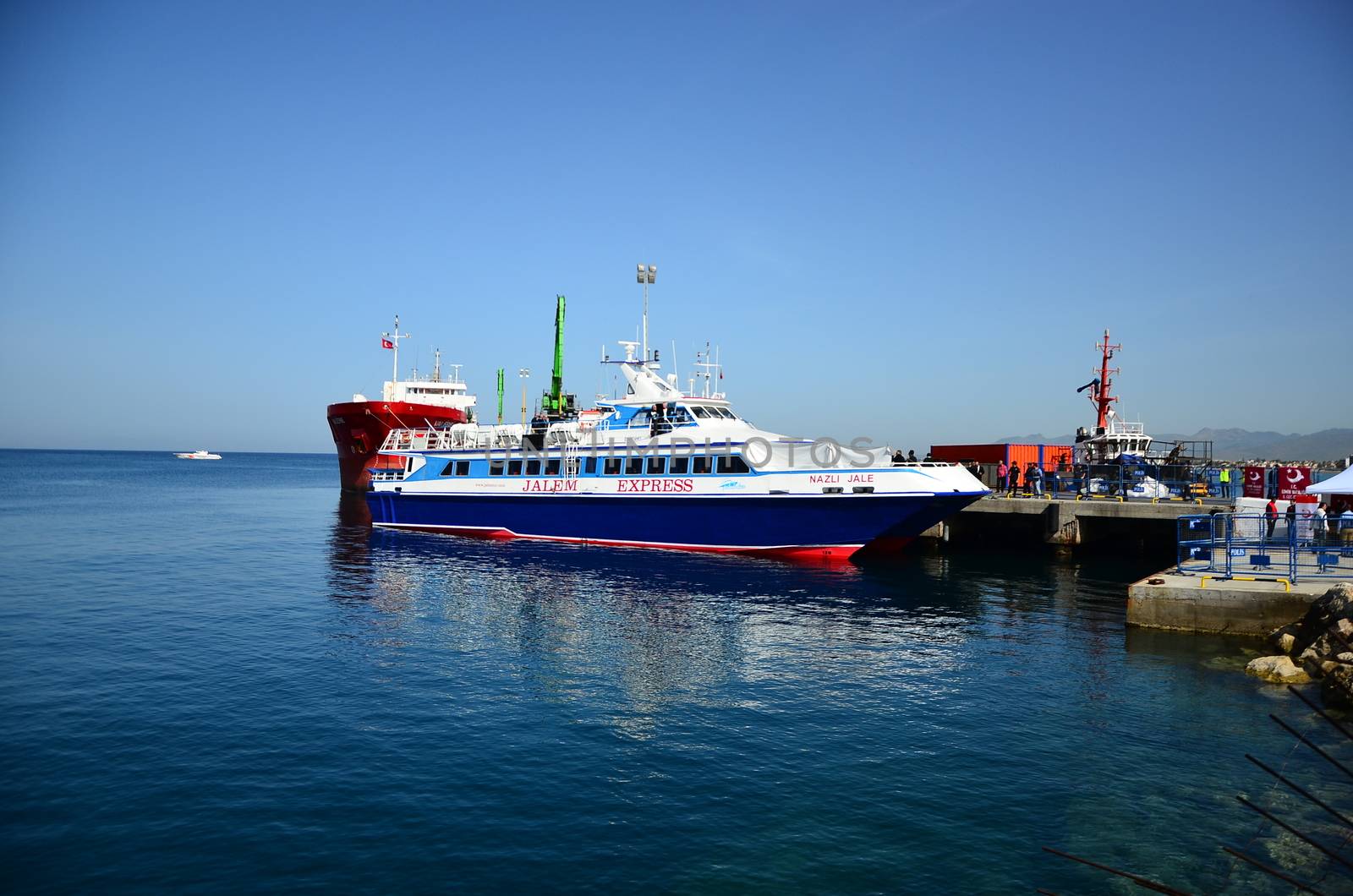 TURKEY, Dikili: A small Turkish ferry carrying migrants who are deported from Lesbos and Chios islands in Greece to Turkey, arrive on April 4, 2016 in the port of Dikili, in Izmir district. Migrants return from Greece to Turkey begun under the terms of an EU deal that has worried aid groups, as Athens struggles to manage the overload of desperate people on its soil. Over 51,000 refugees and migrants seeking to reach northern Europe are stuck in Greece, after Balkan states sealed their borders. Hundreds more continue to land on the Greek islands every day despite the EU deal.