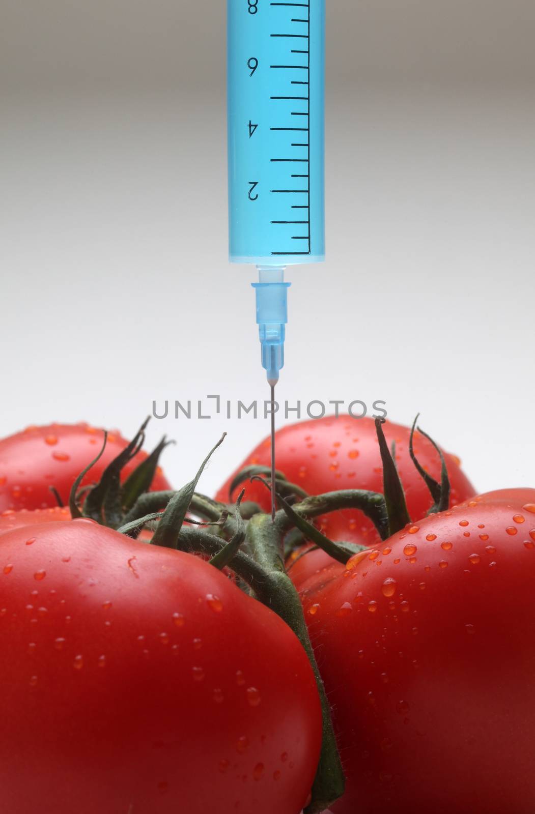 Injection into fresh red tomato