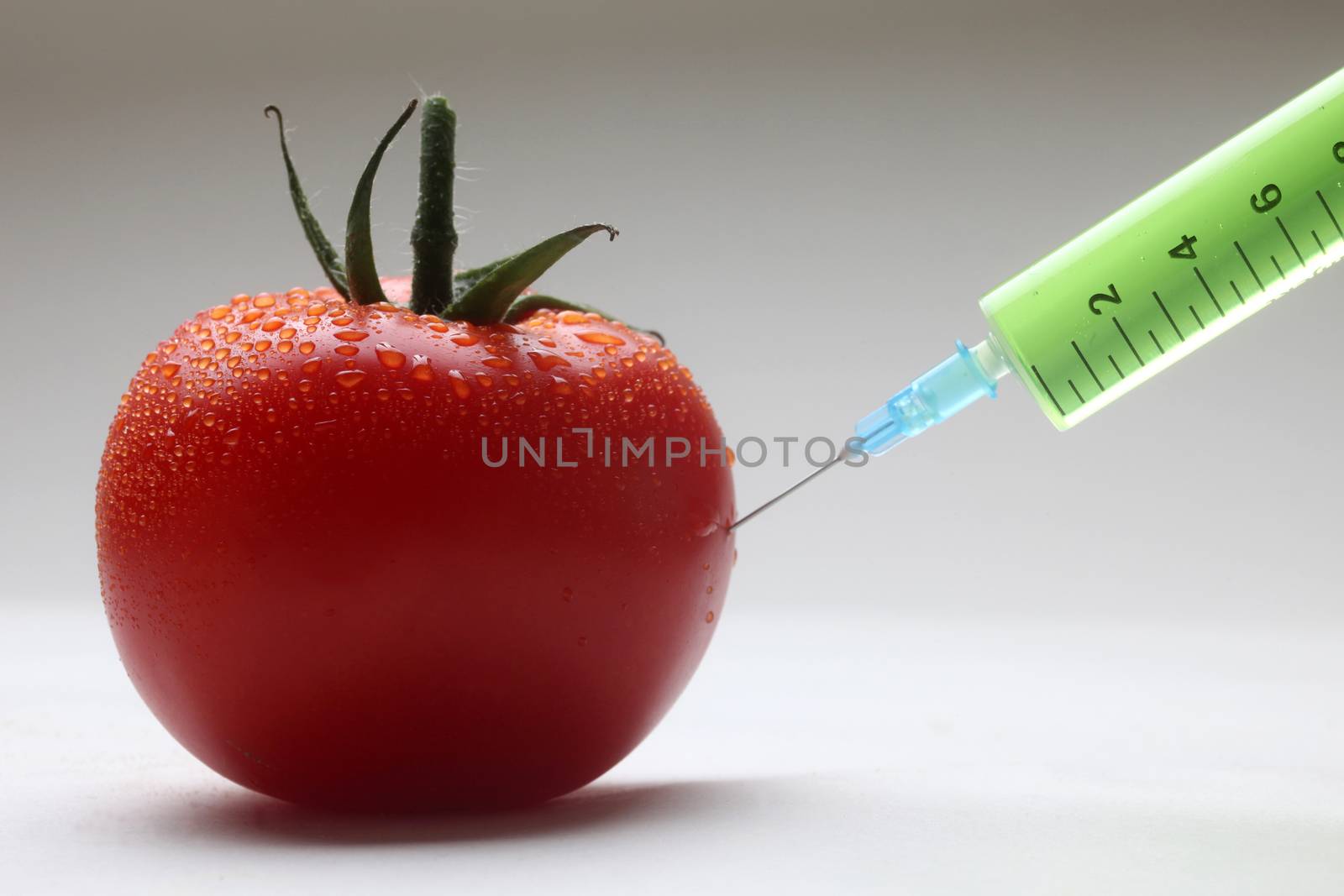 Injection into fresh red tomato