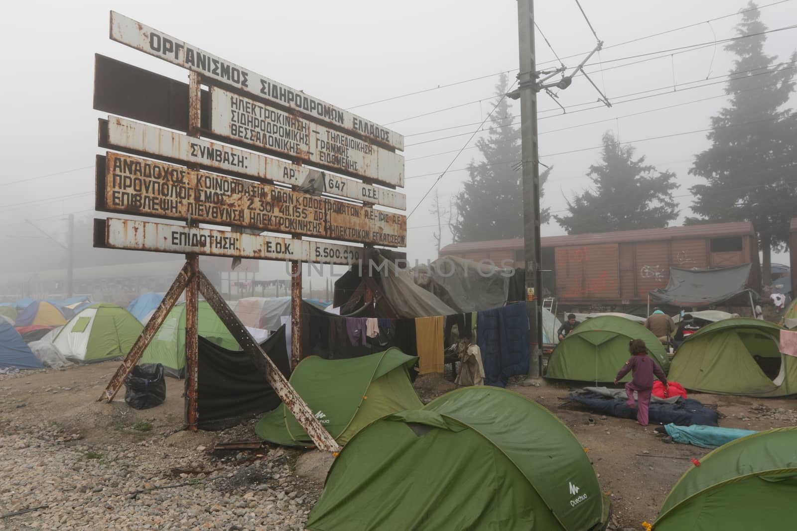 GREECE, Idomeni: A picture is taken of a makeshift camp set by migrants on April 4, 2016 at Greece-Macedonian border, near Idomeni village where thousands of people are stranded by the Balkan border blockade. Migrants return from Greece to Turkey begun under the terms of an EU deal that has worried aid groups that same day, as Athens struggles to manage the overload of desperate people on its soil. Over 51,000 refugees and migrants seeking to reach northern Europe are stuck in Greece, after Balkan states sealed their borders. Under the agreement, designed to halt the main influx which comes from Turkey, all irregular migrants arriving since March 20 face being sent back, although the deal calls for each case to be examined individually. For every Syrian refugee returned, another Syrian refugee will be resettled from Turkey to the EU, with numbers capped at 72,000.