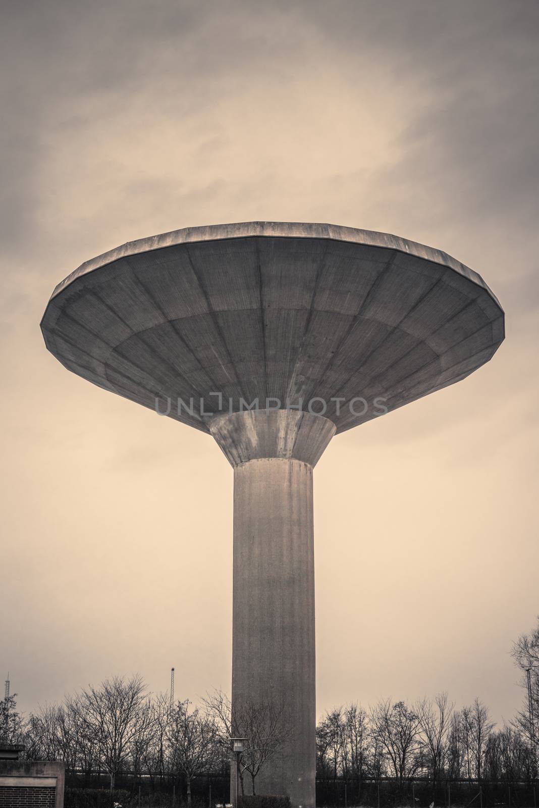 Water tower in Denmark in dark cloudy weather