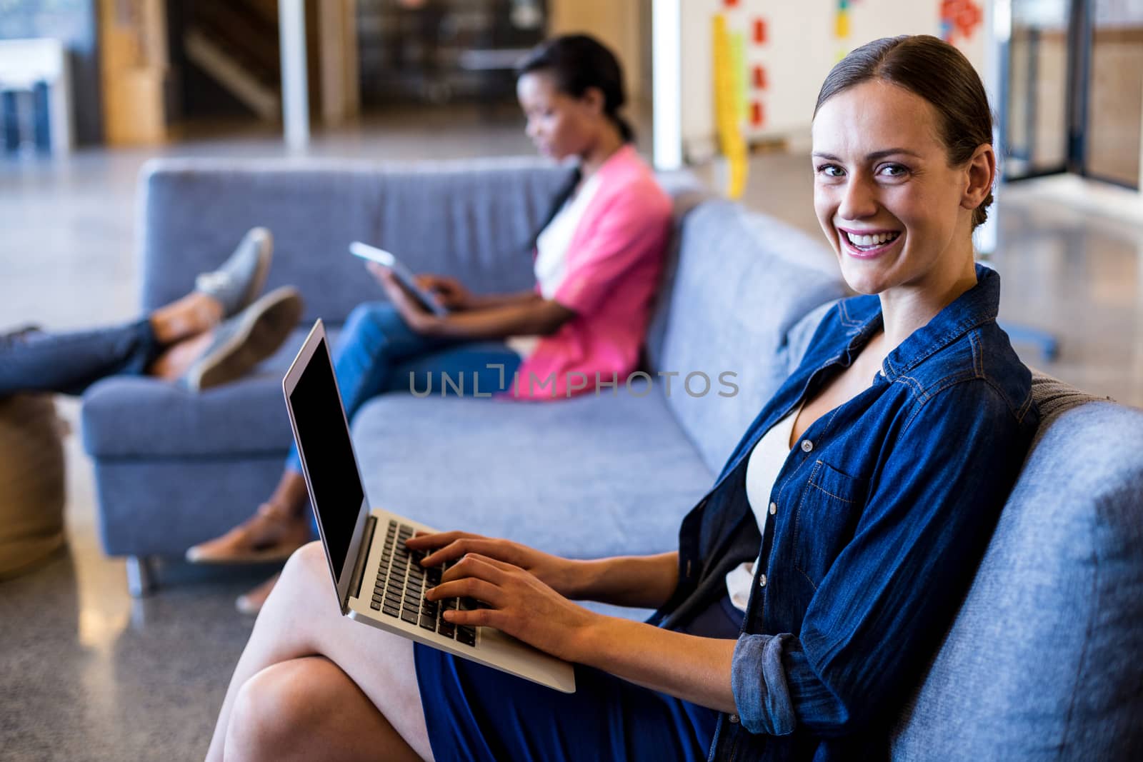 Young woman using laptop by Wavebreakmedia