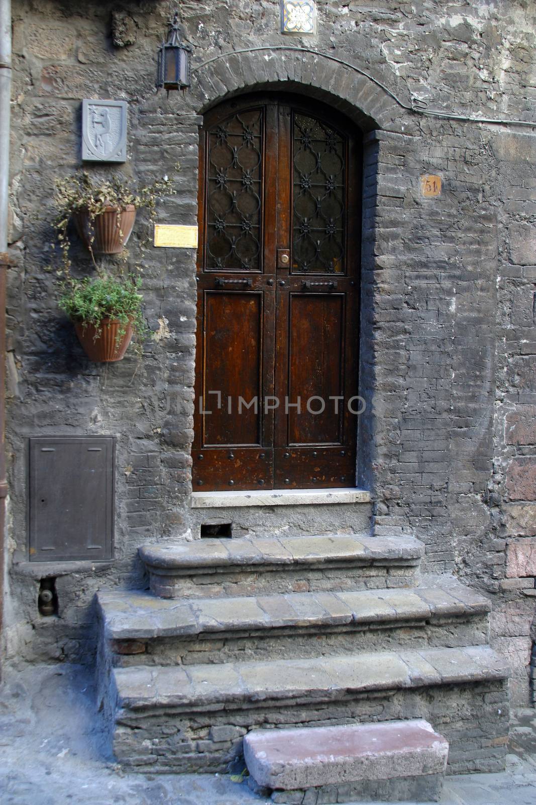 Wooden door with a stone door frame