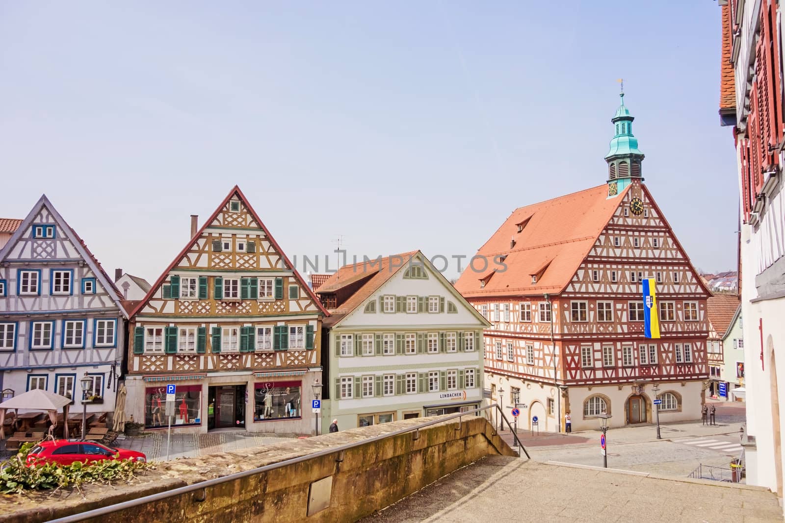 Backnang, Germany - April 03, 2016: In the city center of Backnang at marketplace, town hall on the right, half-timbered buildings.