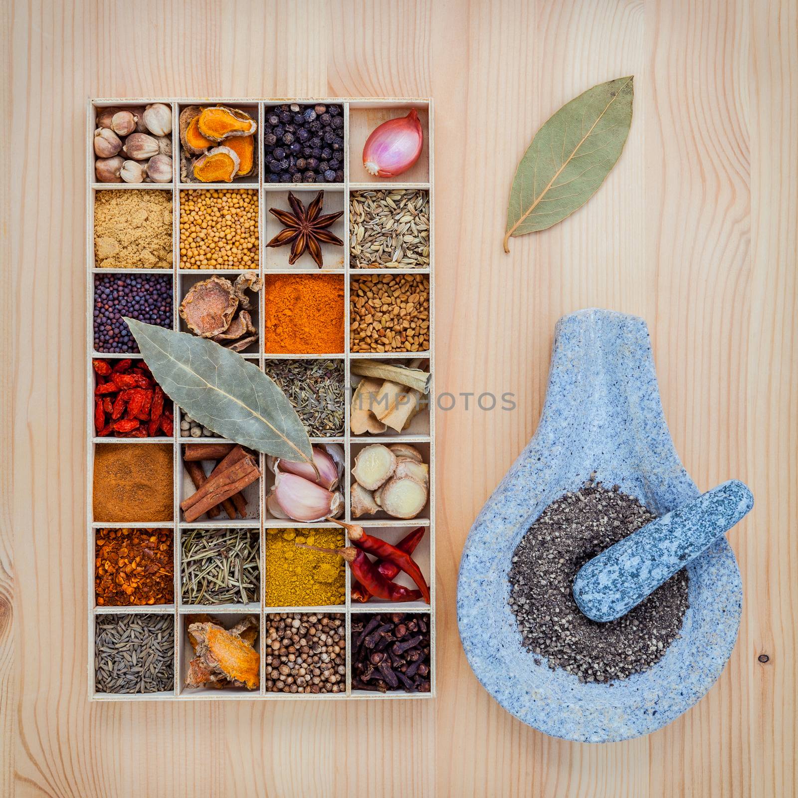 Assortment of spices food cooking ingredients in wooden box and  by kerdkanno