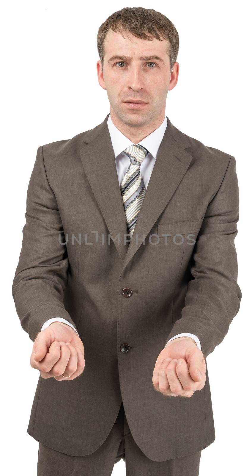 Businessman holding hands in front of him and looking at camera
