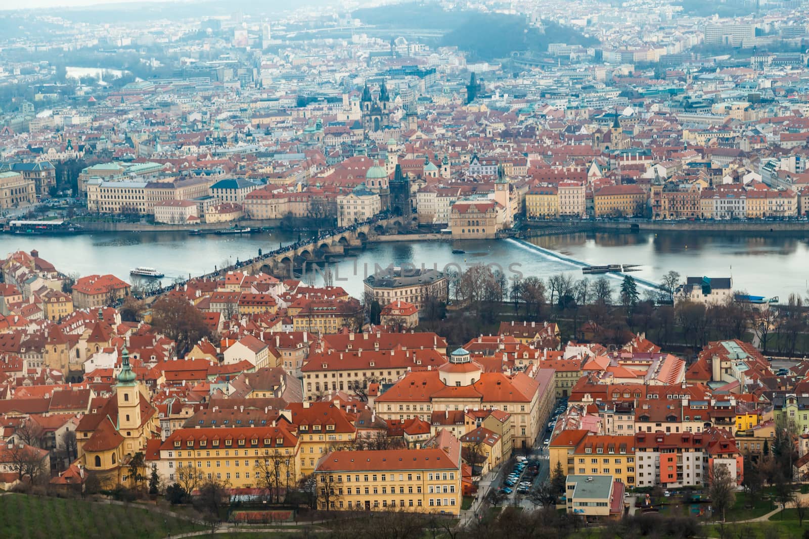 General top view of historical gothic Prague cityscape with old buildings and towers around.