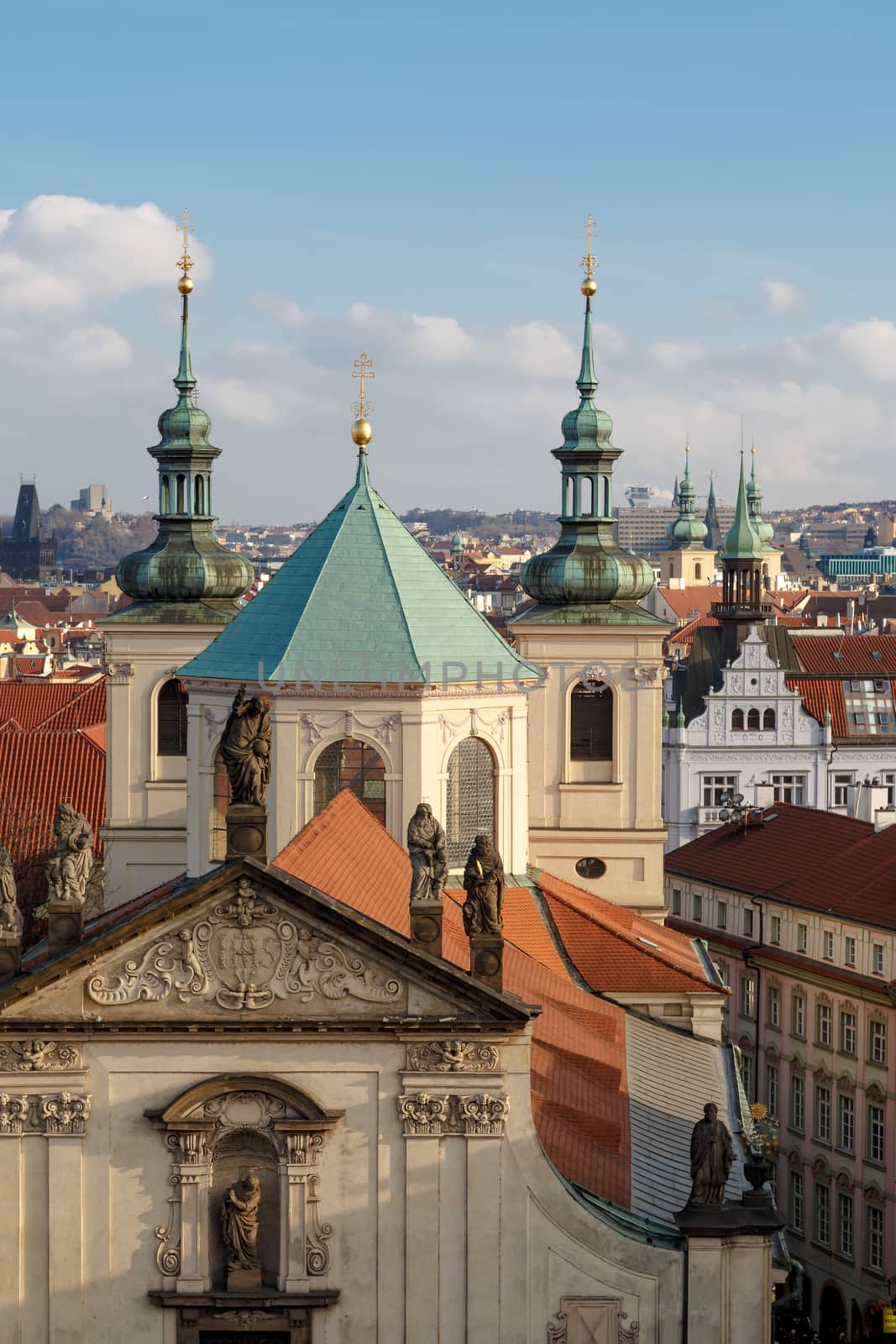 Historical gothic cityscape view from Old Town Bridge Tower in Prague, on cloudy sky background.