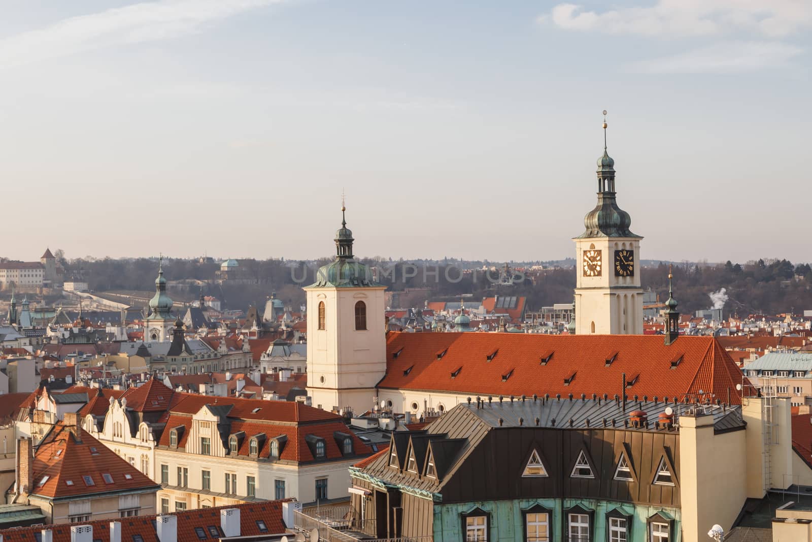 Cityscape top view of Prague old town from Powder Tower or Powder Gate on cloudy sky background.