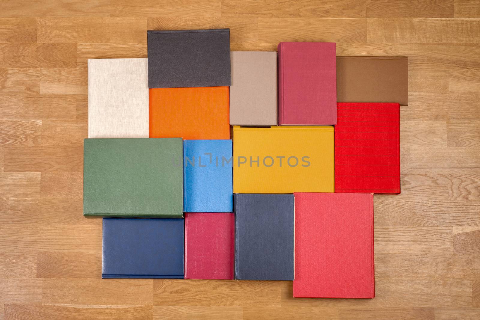 colour old books on wooden floor background