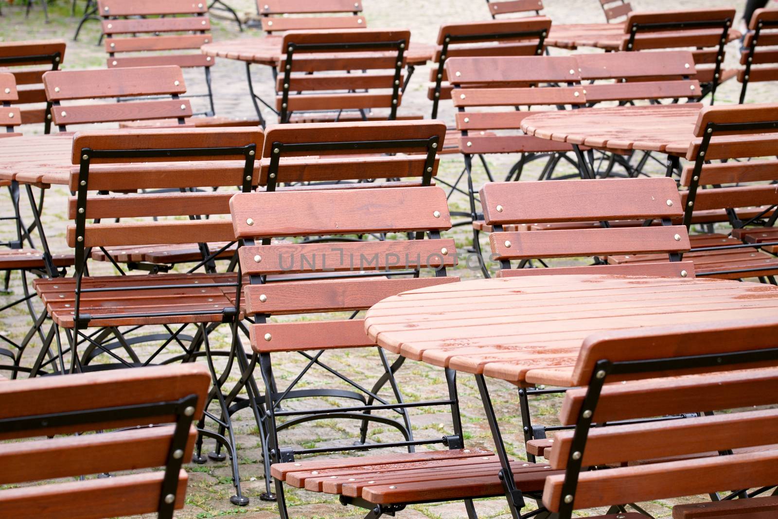 Brown tables and chairs outside a restaurant