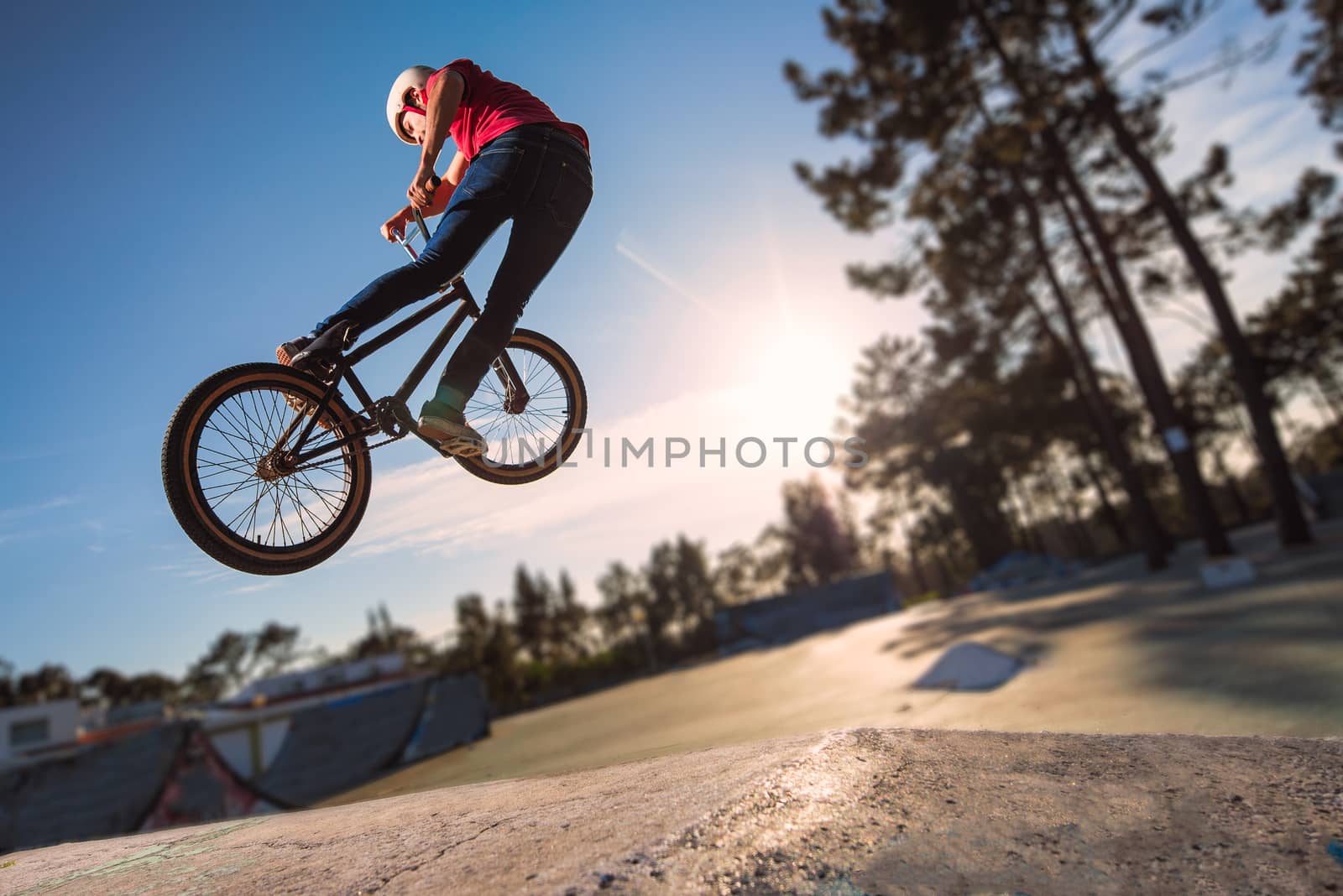 High BMX jump in a skate park.