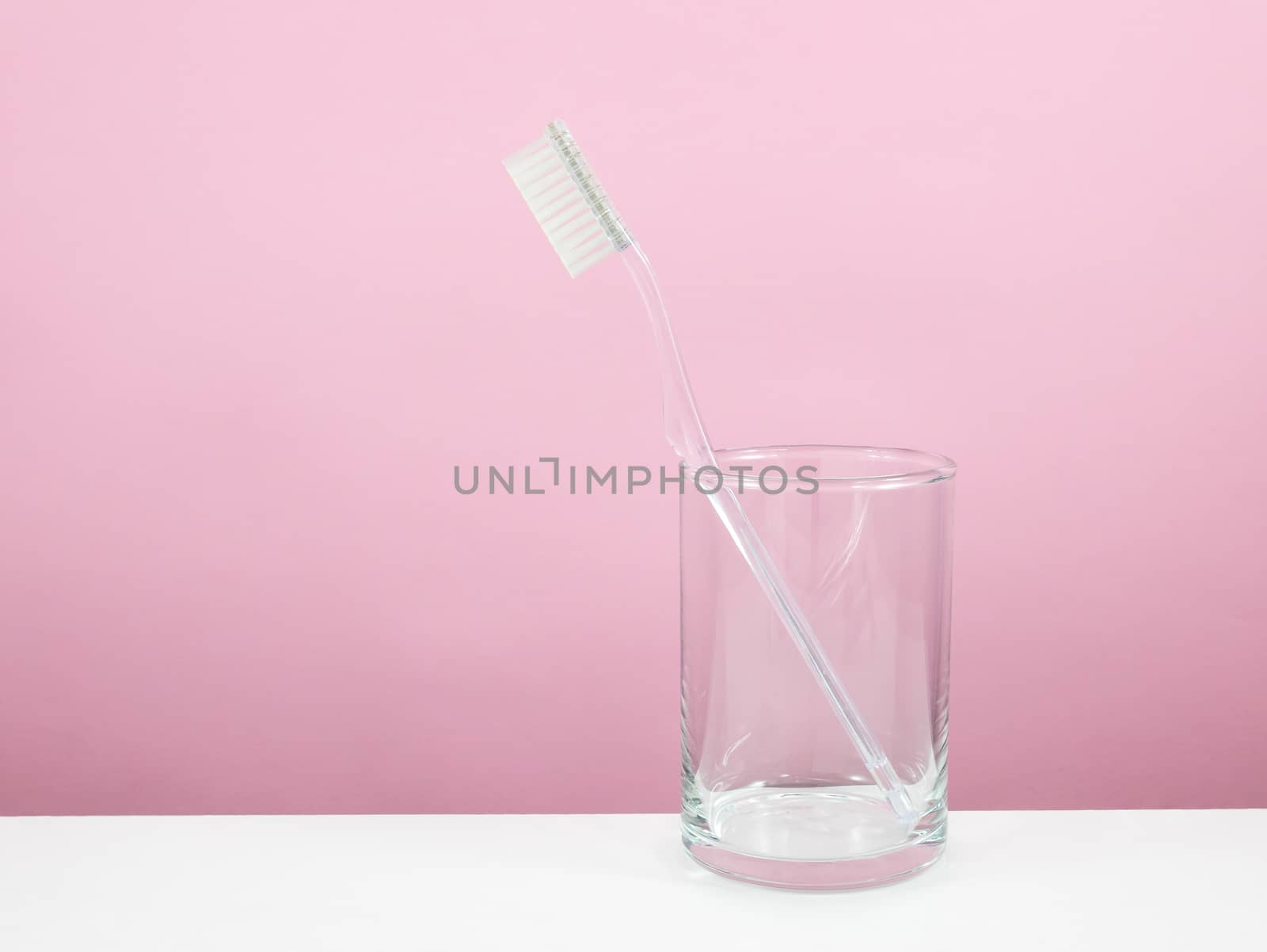 The clear toothbrush with small glass by phasuthorn