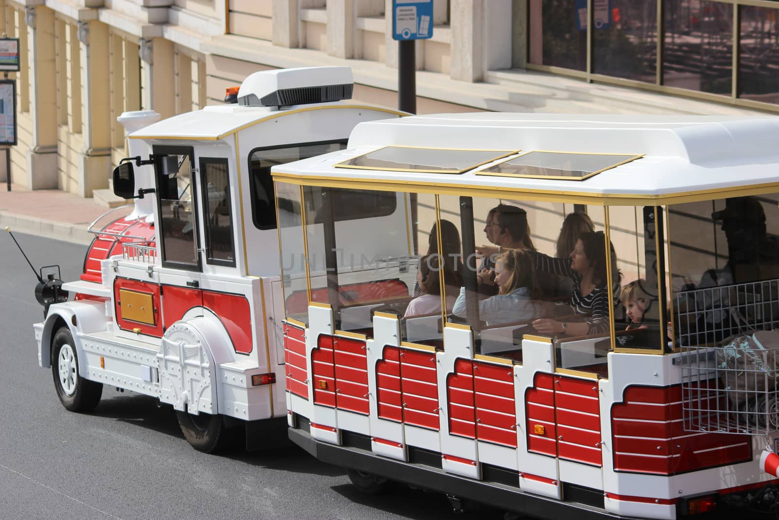Monte-Carlo, Monaco - April 6, 2016: Red and White Trackless Train for Sightseeing in Monaco on the Street of Monte-Carlo, Monaco in the south of France