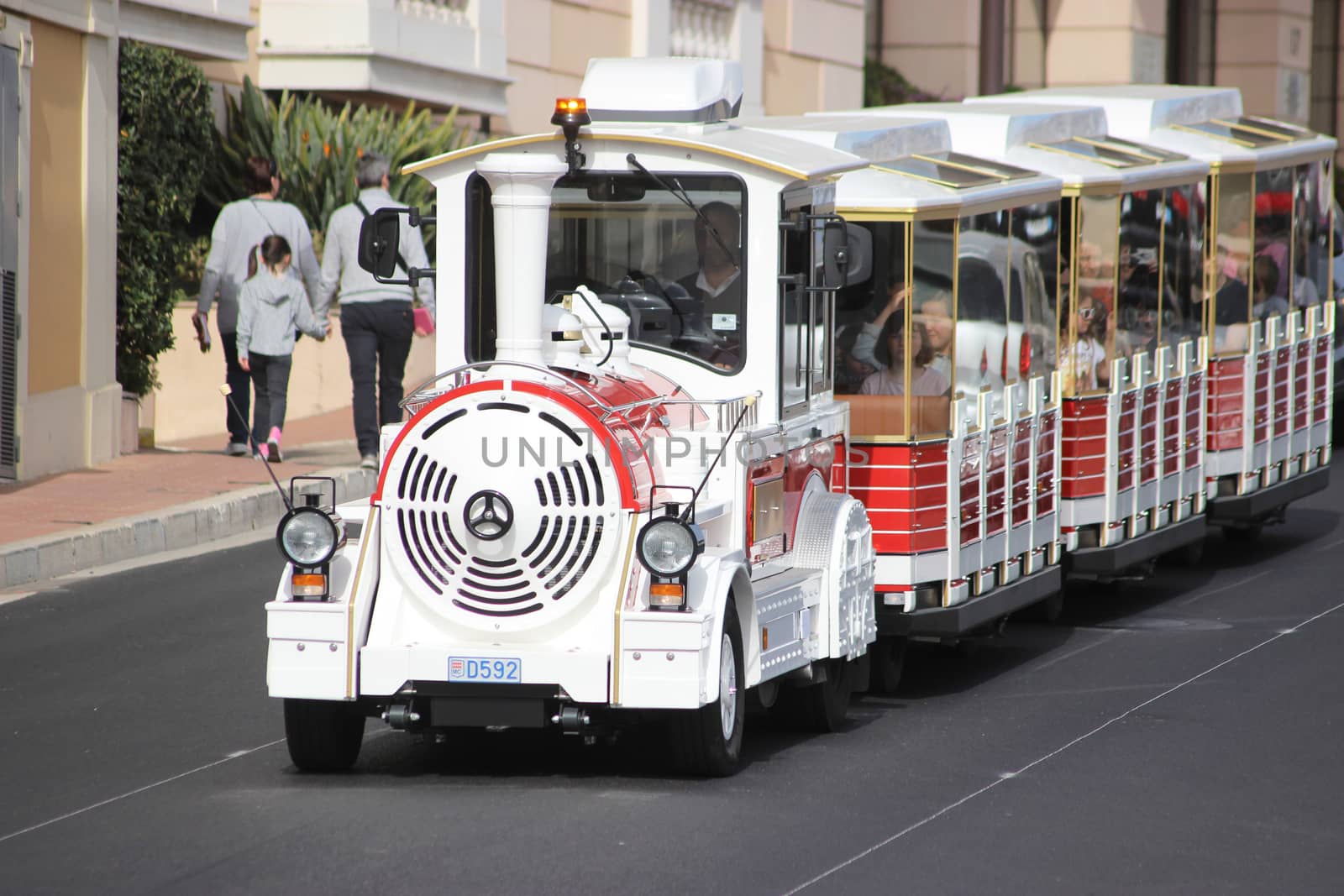 Monte-Carlo, Monaco - April 6, 2016: Red and White Trackless Train for Sightseeing in Monaco on the Street of Monte-Carlo, Monaco in the south of France