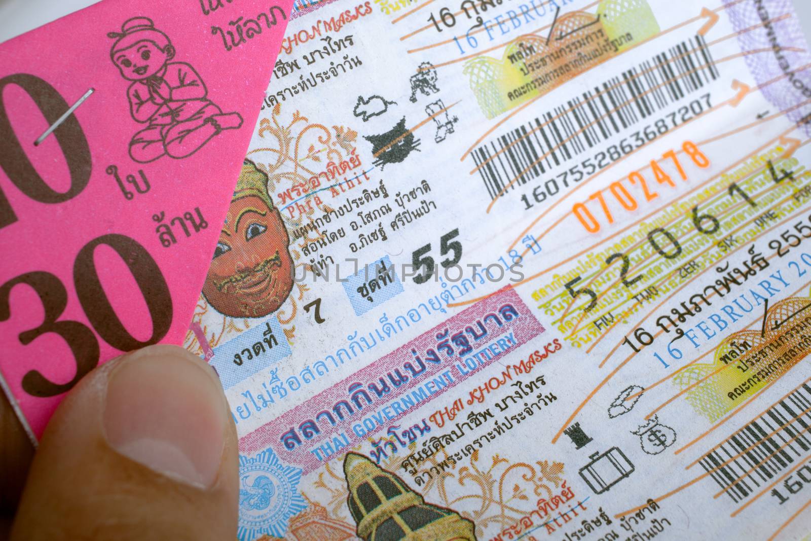 BANGKOK, THAILAND - FEBRUARY 10, 2015: Lottery ticket sold on corrugated plastic board, in the markets of Bangkok in Thailand, on February 10, 2015