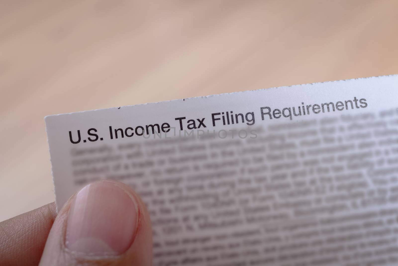 US incoming tax and hand for business concept background by FrameAngel