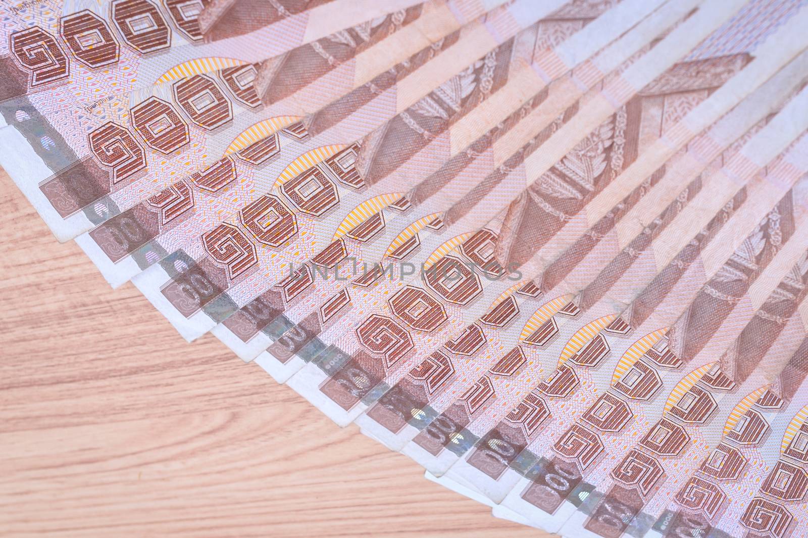Thai baht banknotes on table background