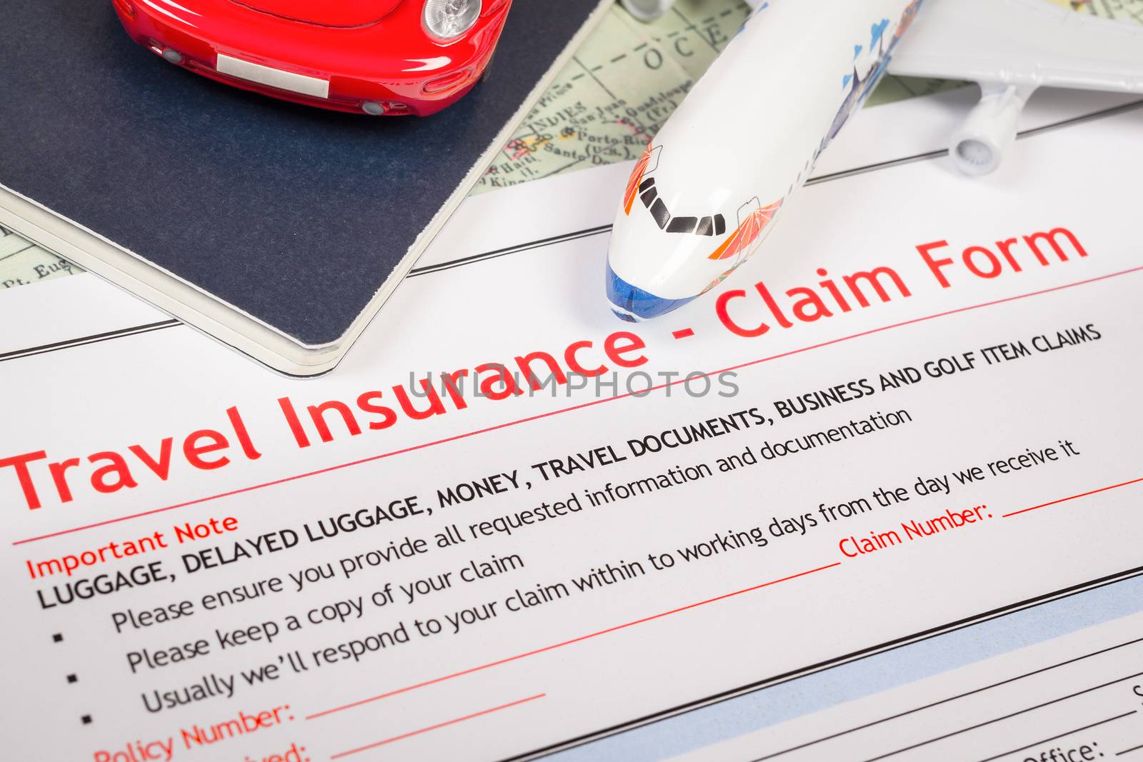 Travel Insurance Claim application form on table, business and r by FrameAngel