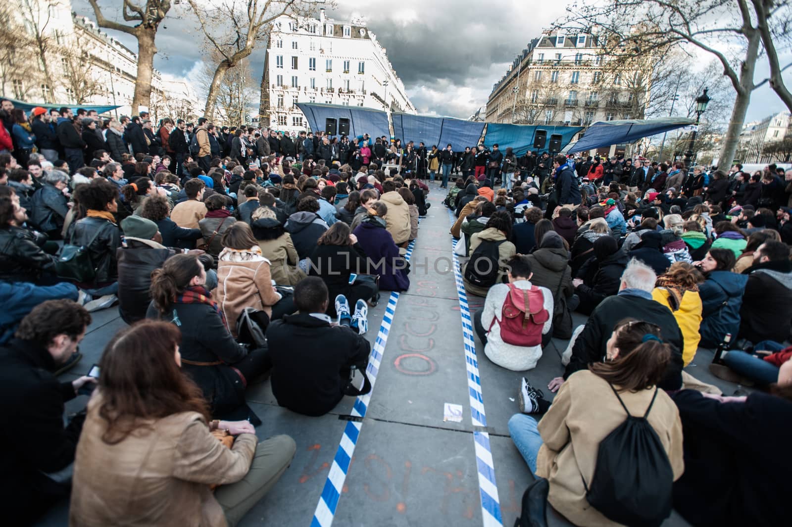 FRANCE, Paris: Thousand militants of the Nuit debout (Standing night) movement gather on April 7, 2016 at the Place de la Republique in Paris, as participants plan to spend the night camped out to protest against the government's planned labour reform and against forced evictions. It has been one week that hundred of people have occupied the square to show, at first, their opposition to the labour reforms in the wake of the nationwide demonstration which took place on March 31, 2016.