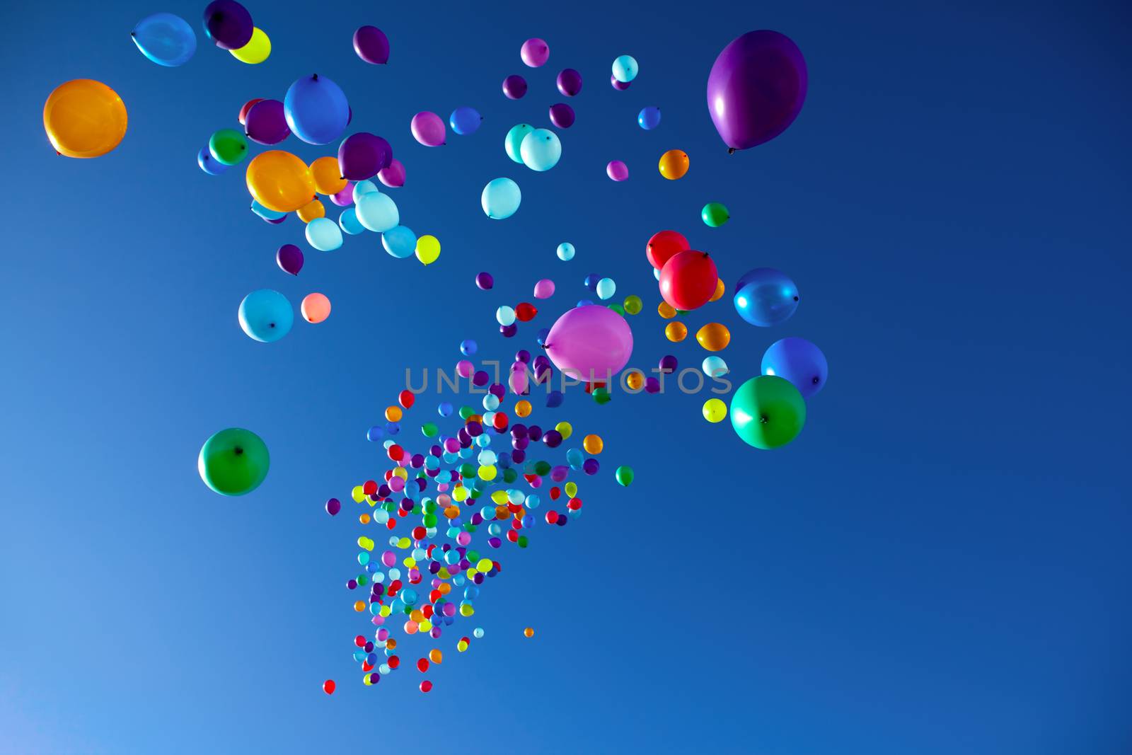 colorful balloons on a blue sky background