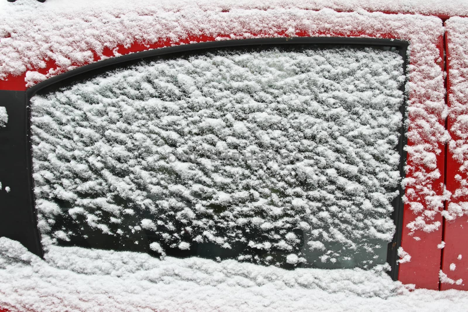 red car under the snow in denmark