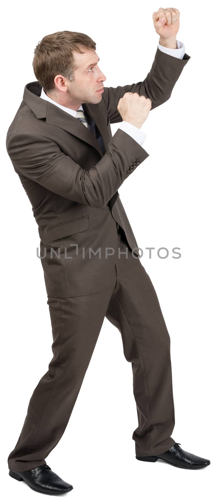Businessman standing in fighting stock by cherezoff