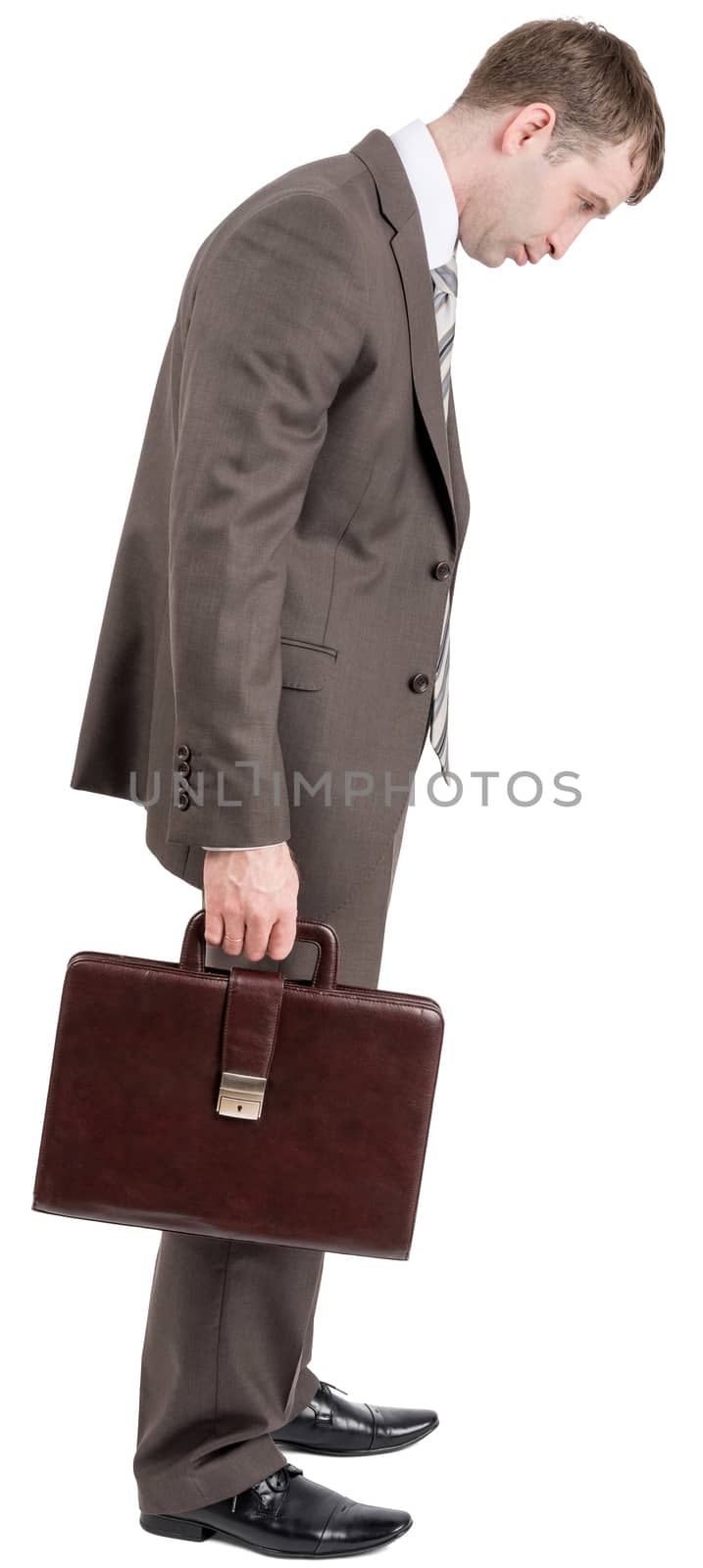 Sad businessman looking down isolated on white background