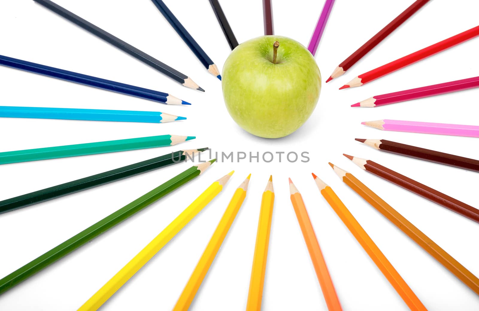 Apple with colorful crayons isolated on white background
