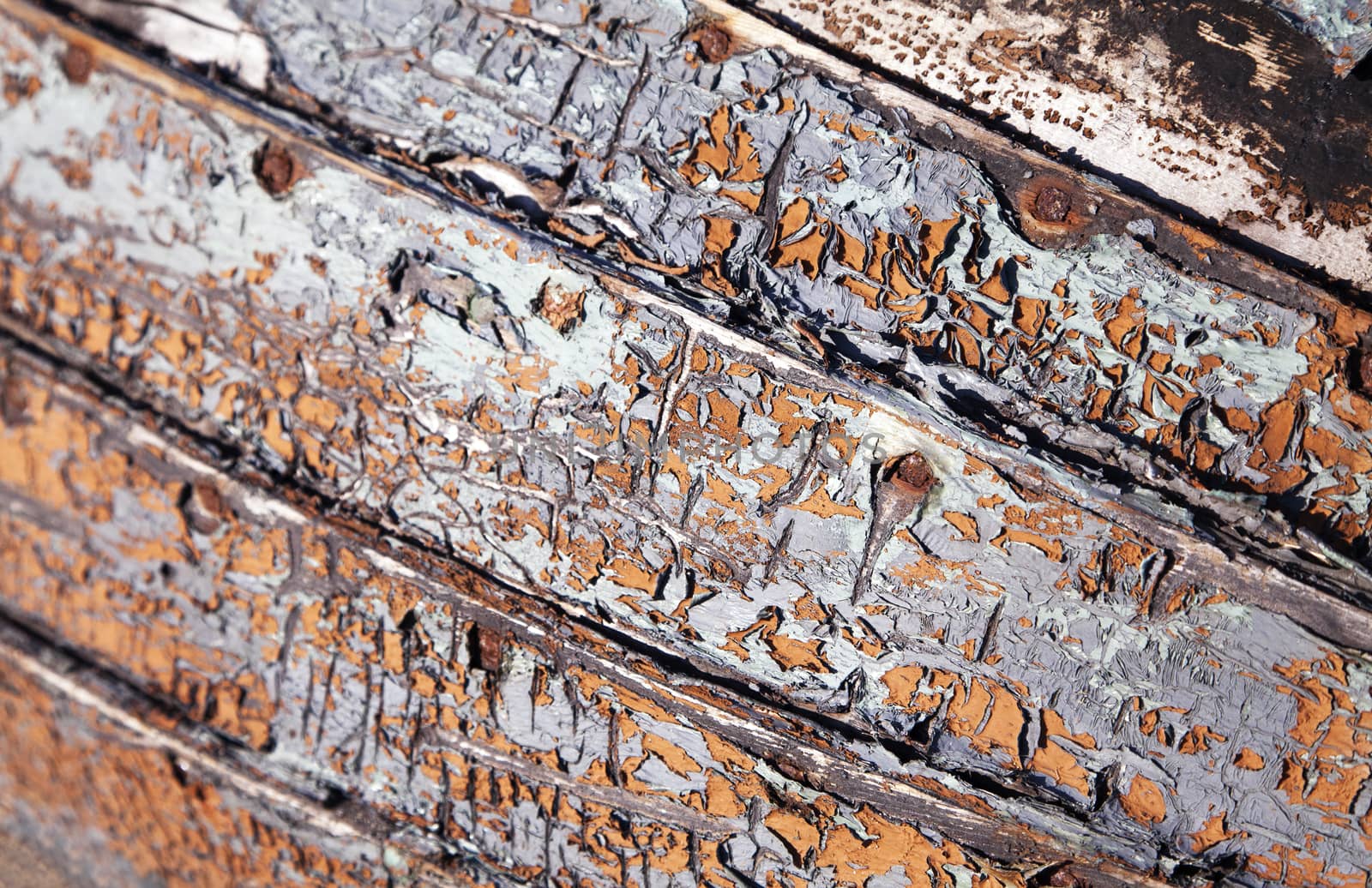 Close-up of an old abandoned boat with peeling paint