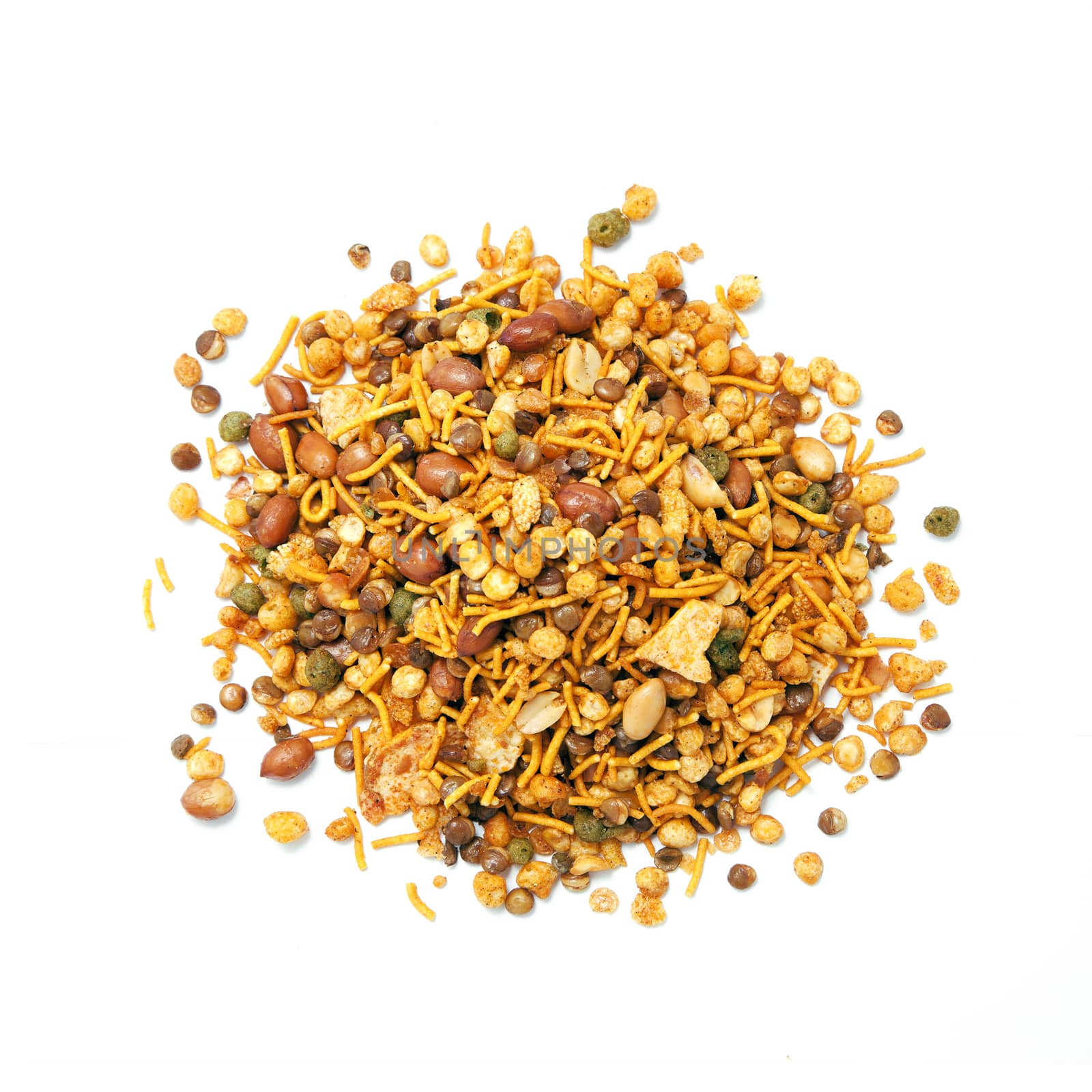 Pile of dry roasted Indian snack mix, isolated over white