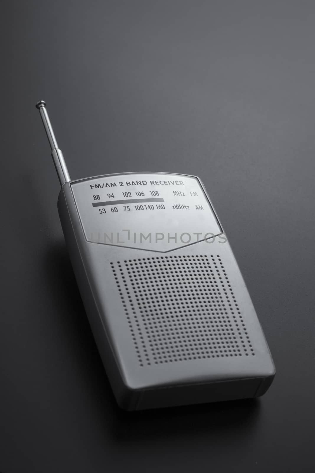 Radio receiver gray isolated on a dark background by mailos