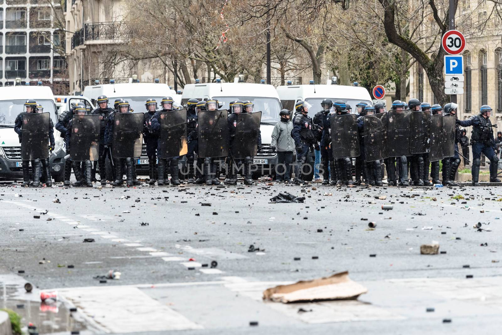 FRANCE, Paris: Riot policemen stand in line during a protest on April 9, 2016 in Paris, against the French government's proposed labour law reforms.
