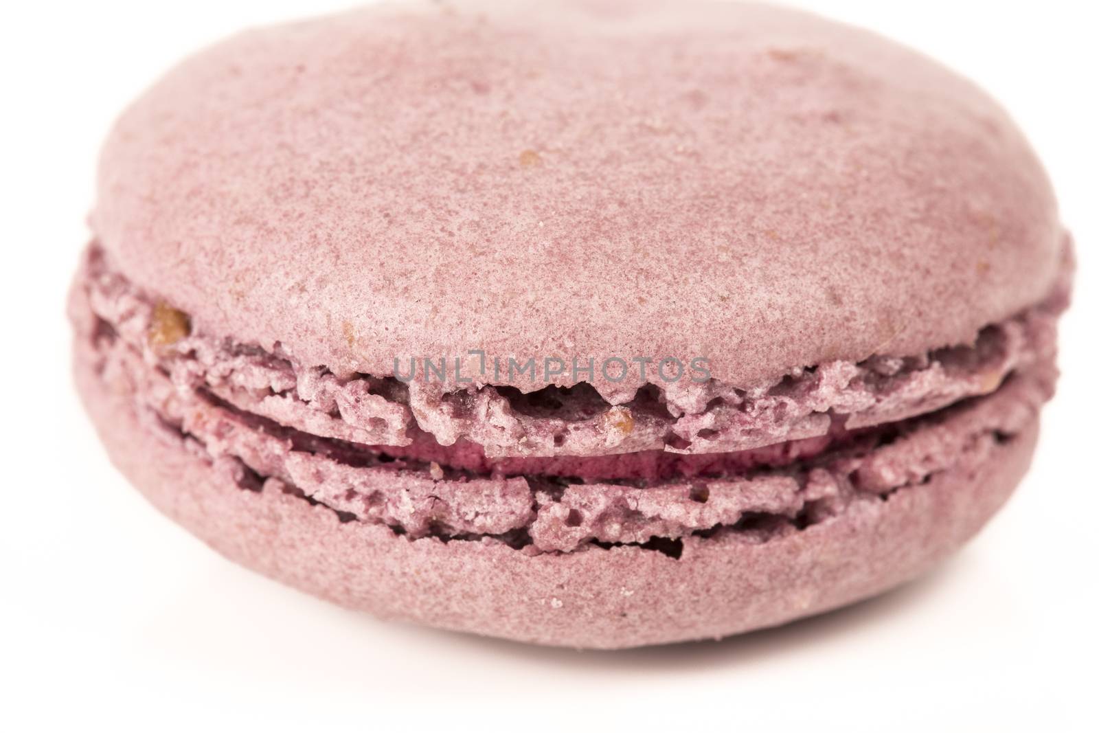 French colorful home made violet macarons  on white bakground