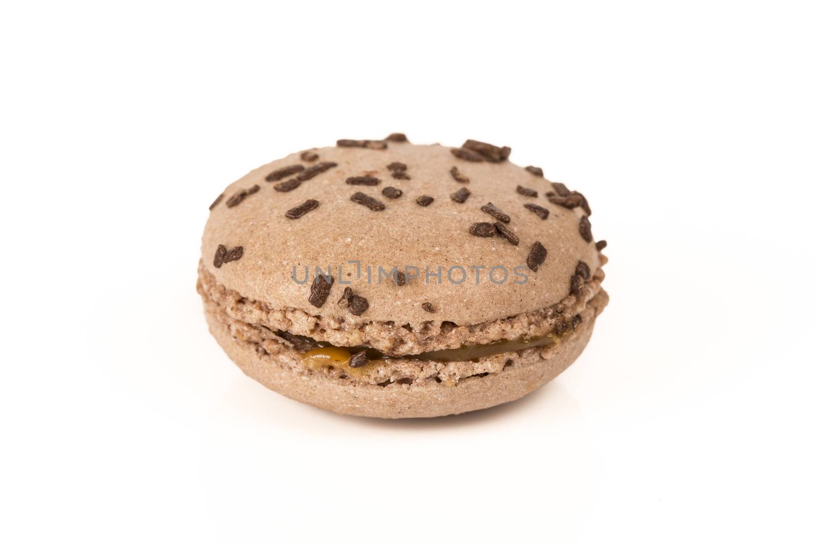 French colorful home made chocolate macarons  on white bakground
