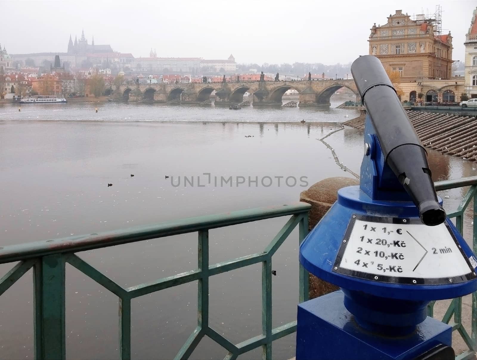 Coin operated binoculars with The old city of Prague, capital of Czech Republic