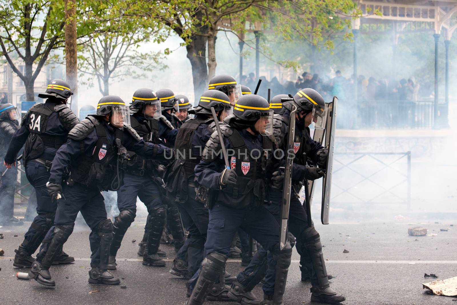 FRANCE, Paris: Riot policemen gather to face violent protesters during a demo on April 9, 2016 in Paris, against the French government's proposed labour law reforms.