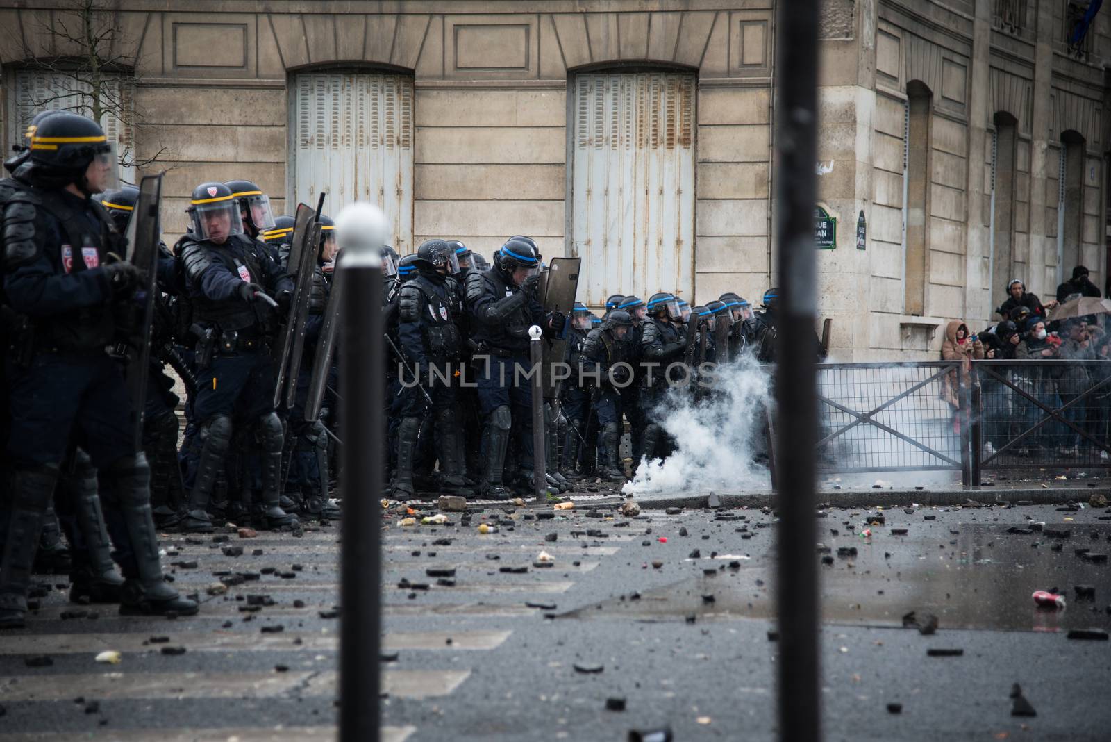 FRANCE, Paris: Riot policemen stand in line during a demo on April 9, 2016 in Paris, against the French government's proposed labour law reforms.