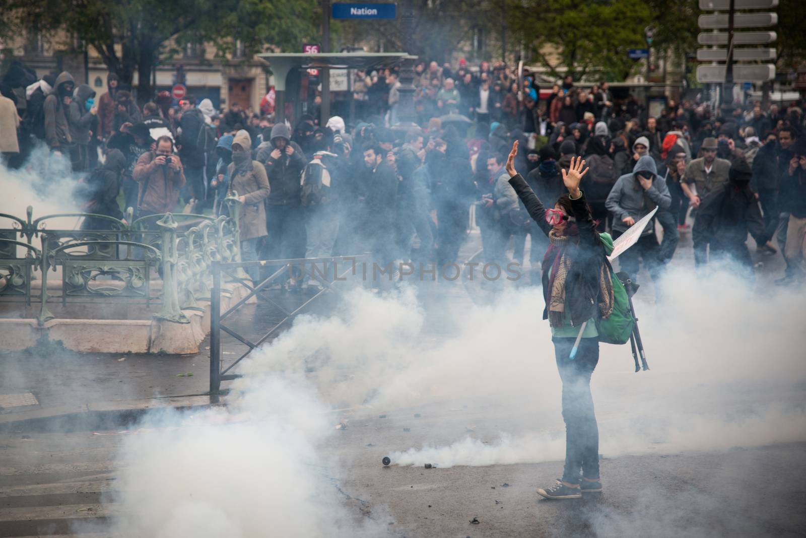 FRANCE, Paris: A protester showing hands face riot policemen during a demo on April 9, 2016 in Paris, against the French government's proposed labour law reforms.