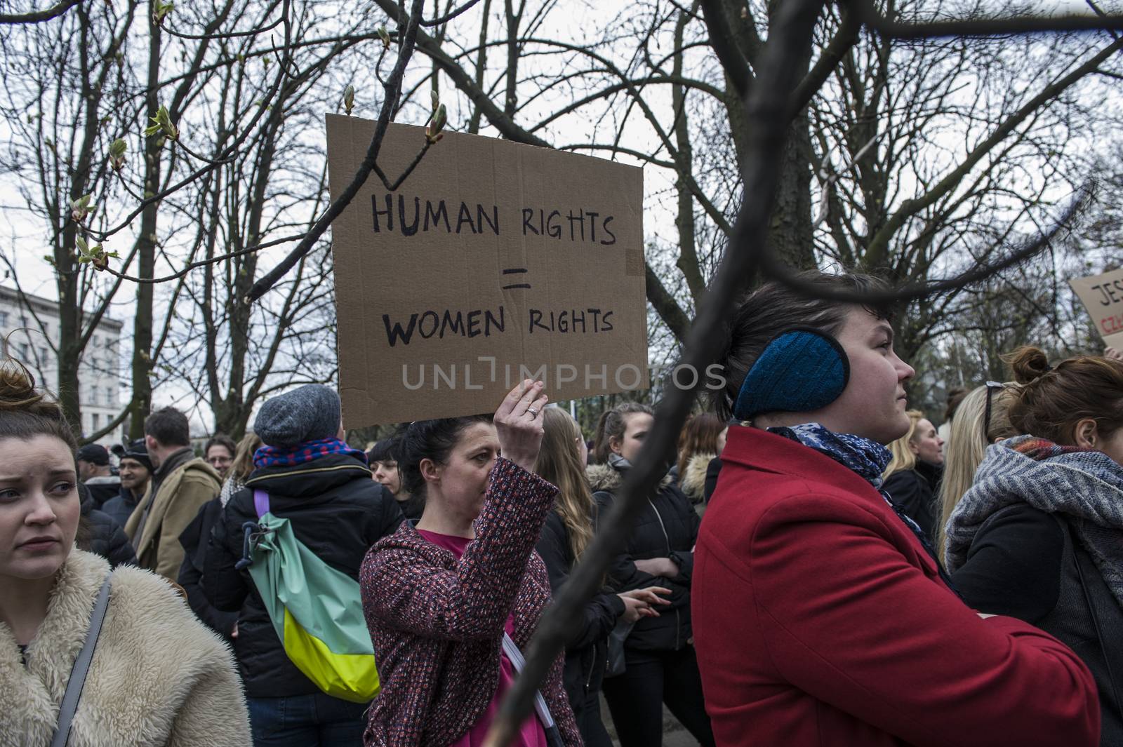POLAND, Warsaw: People attend an anti-government and pro-abortion demonstration in front of parliament, on April 9, 2016 in Warsaw. The banner reads 'Human rights = women rights'. 