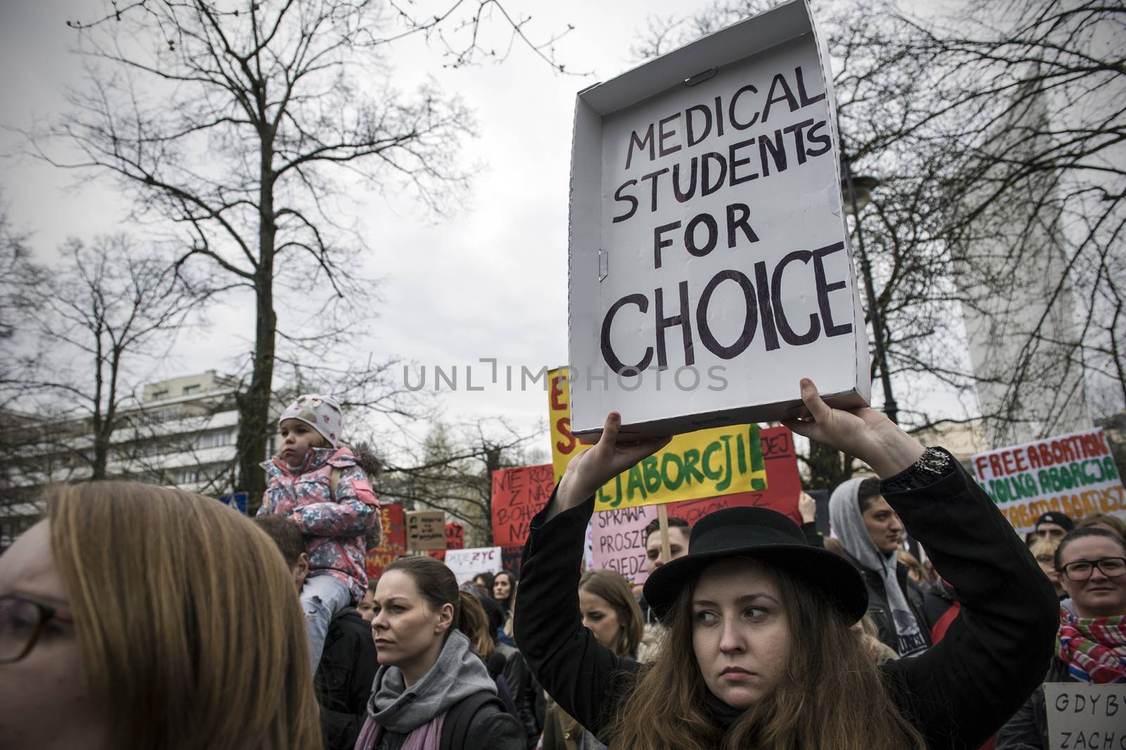 POLAND, Warsaw: People attend an anti-government and pro-abortion demonstration in front of parliament, on April 9, 2016 in Warsaw. The banner reads 'Medical students for choice'. 