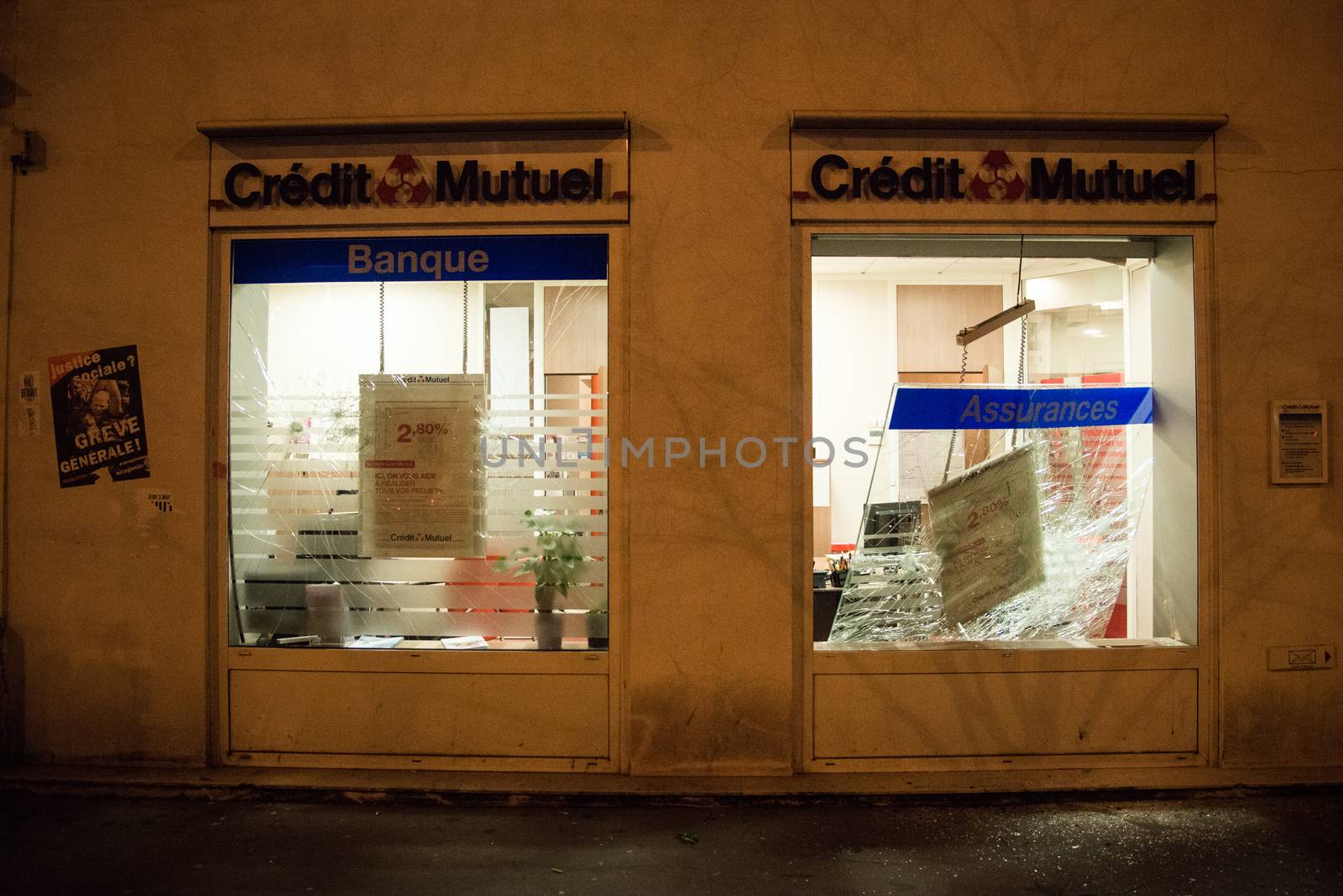FRANCE, Paris: Credit Mutuel bank shop front is pictured destroyed after Nuit Debout militants demonstrate to reach French Prime minister Manuel Valls residence in Paris on April 9, 2016.
