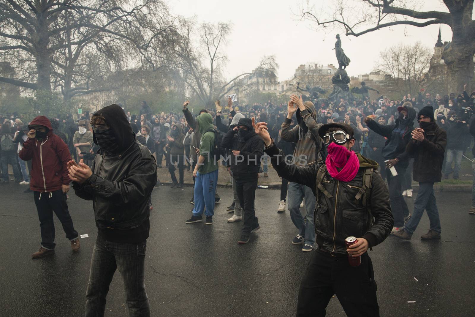 FRANCE, Paris: Protesters gather during clashes with riot police at the end of a demonstration against planned labour reforms, in Paris, France, on April 9, 2016.